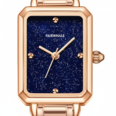 Rose gold watch with blue starry face and 'FAIRWHALE' brand on a white background