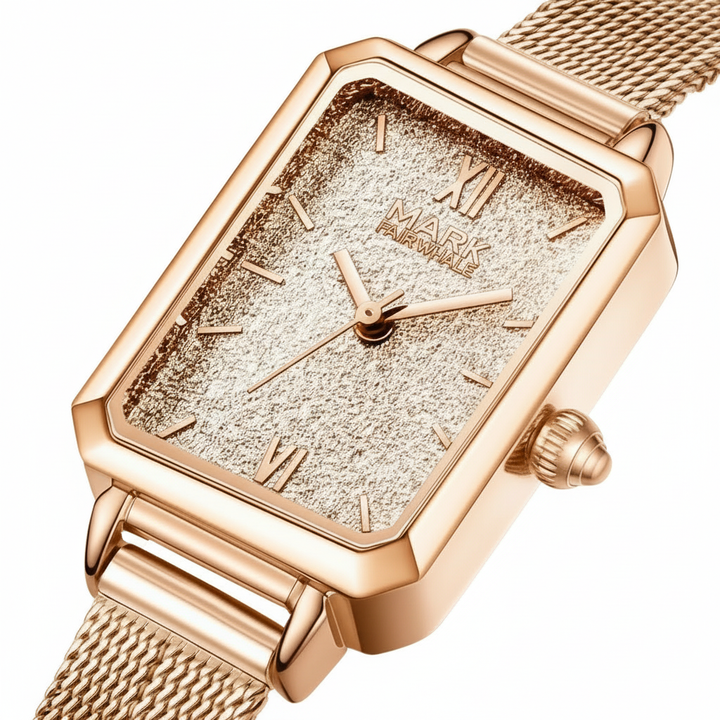 Rose gold watch with textured face and mesh band on a white background