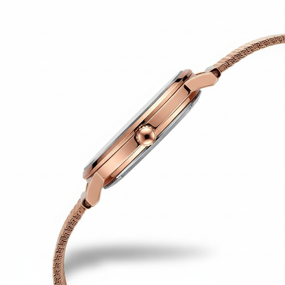 Rose gold watch with a white background