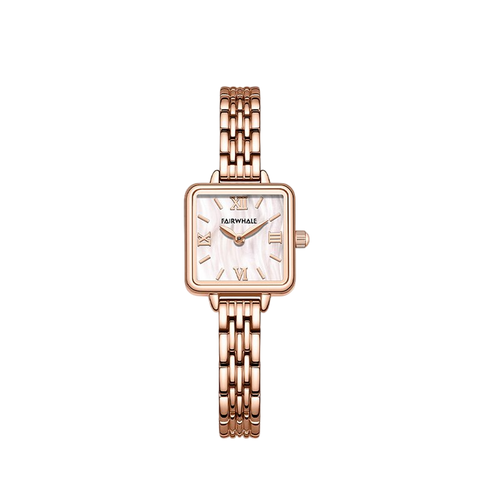 Rose gold watch with a white face on a white background