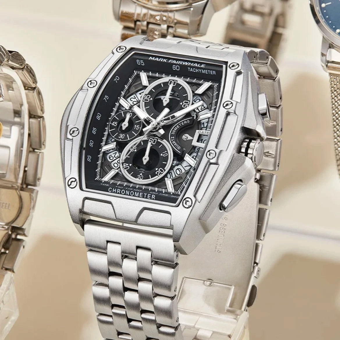 Silver Mark Fairwhale 5080 TONIXORA chronograph watch displayed among luxury timepieces