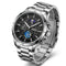 Silver wristwatch with detailed face on a white background