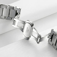 Silver bracelet on a light gray background