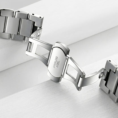 Silver bracelet on a light gray background