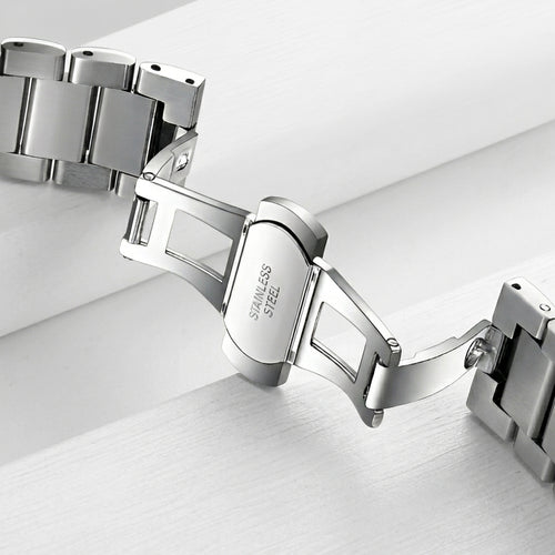 Silver bracelet on a light gray background