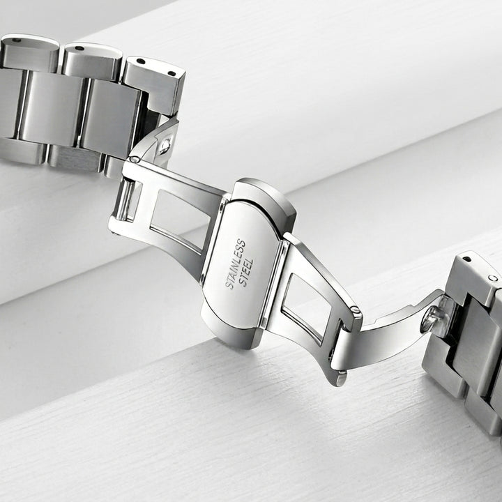 Silver bracelet on a light gray background