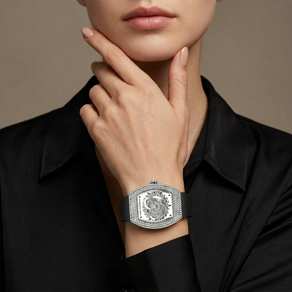 Silver bracelet with intricate design worn by a person against a neutral background