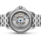 Silver watch with visible mechanical components on a white background