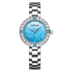 Silver watch with a blue face and gemstone accents on a white background