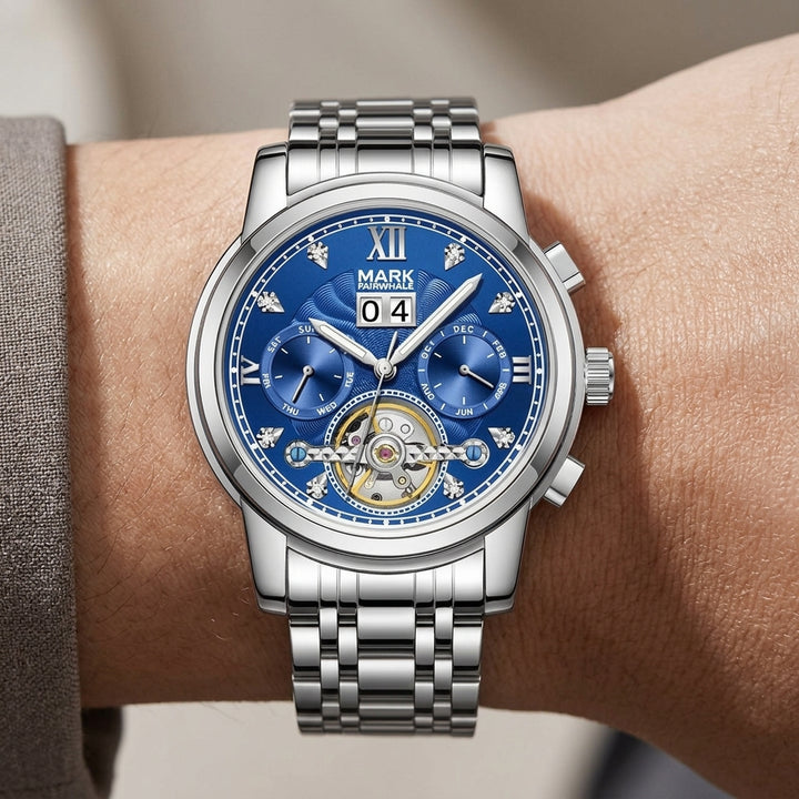 Silver watch with a blue face on a wrist, brand &