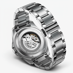 Silver watch with a detailed mechanical back on a white background