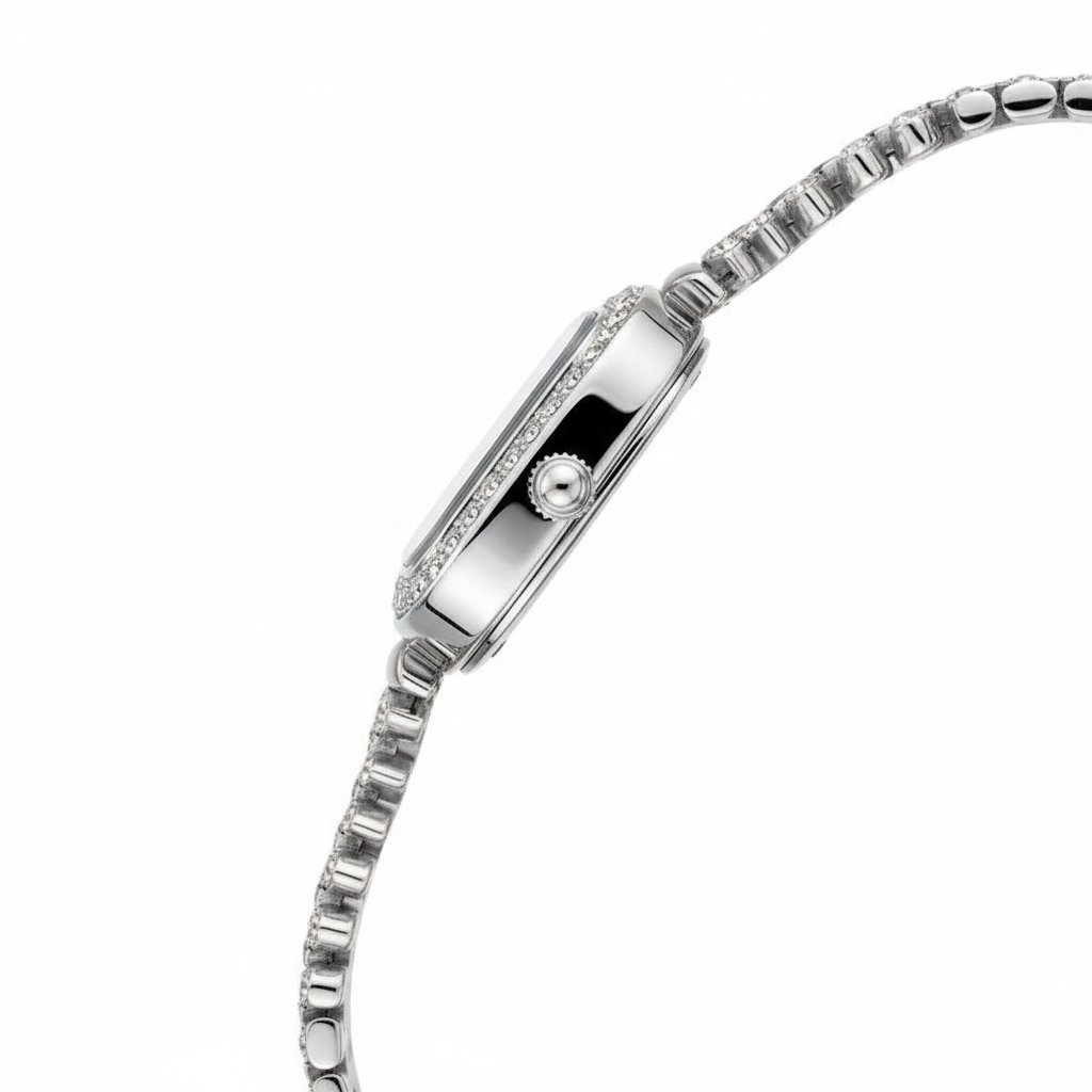 Silver watch with a detailed band on a white background