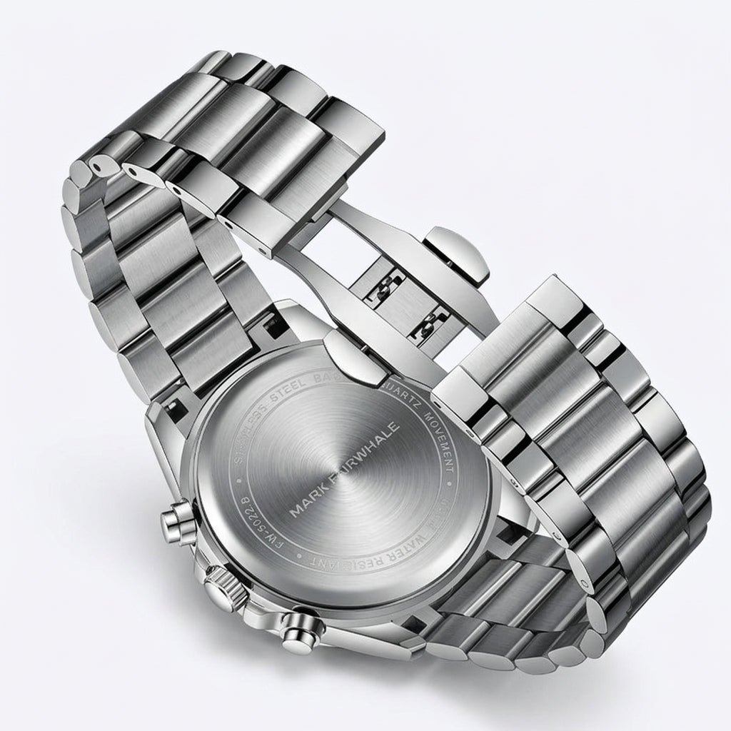 Silver watch with a detailed face on a white background