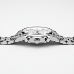 Silver watch with a detailed face on a white background