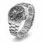 Silver watch with a detailed face on a white background