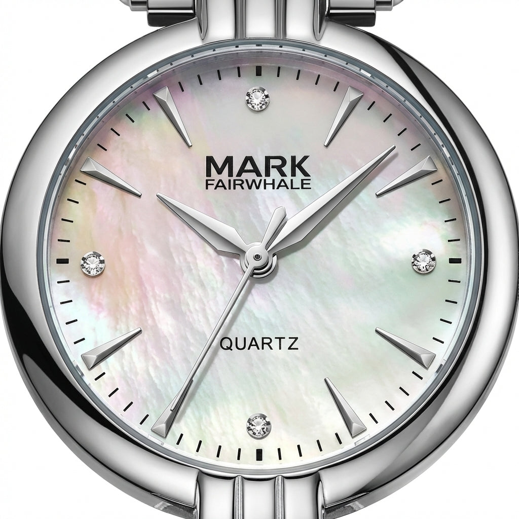Silver watch with a light-colored face displaying the brand &