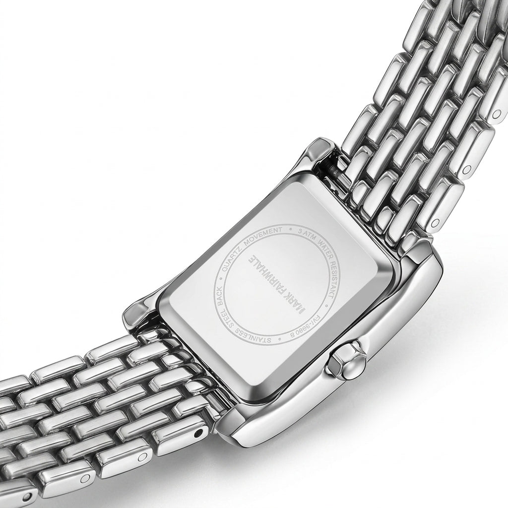 Silver watch with a mesh band on a white background