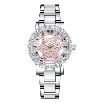 Silver watch with a pink face and diamond-studded bezel on a white background
