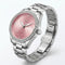 Silver watch with a pink face on a white background
