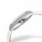 Silver watch with a white strap on a white background