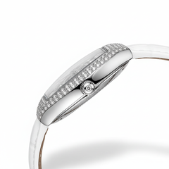 Silver watch with a white strap on a white background