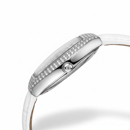 Silver watch with a white strap on a white background