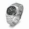 Silver watch with black dial on a white background