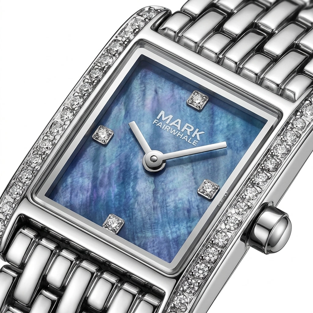 Silver watch with blue face and diamond accents on a white background