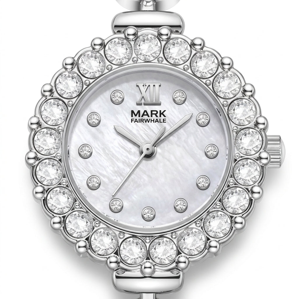 Silver watch with crystal embellishments on a white background