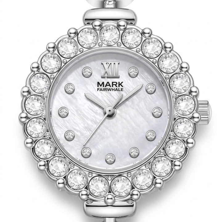 Silver watch with crystal embellishments on a white background