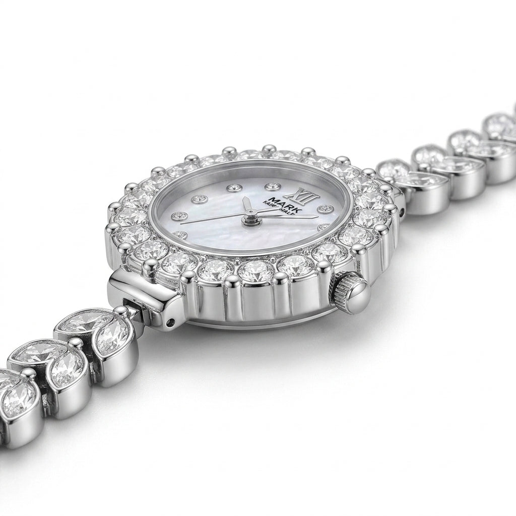 Silver watch with diamond-studded bracelet on a white background