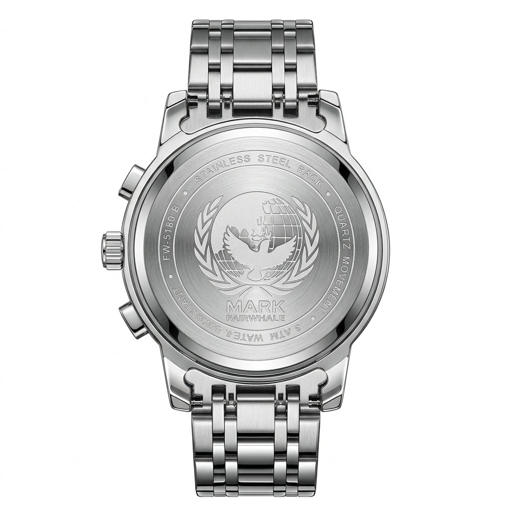 Silver watch with engraved design on a white background