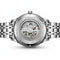 Silver watch with visible brand name on a white background