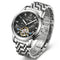 Silver wristwatch with a detailed face on a white background