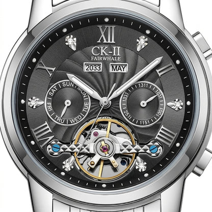 Silver wristwatch with a detailed black face displaying the brand &