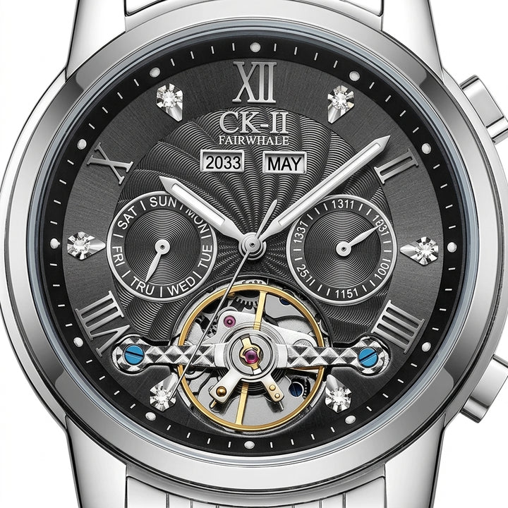 Silver wristwatch with a detailed black face displaying the brand &