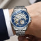 Silver wristwatch with blue face on a person's wrist