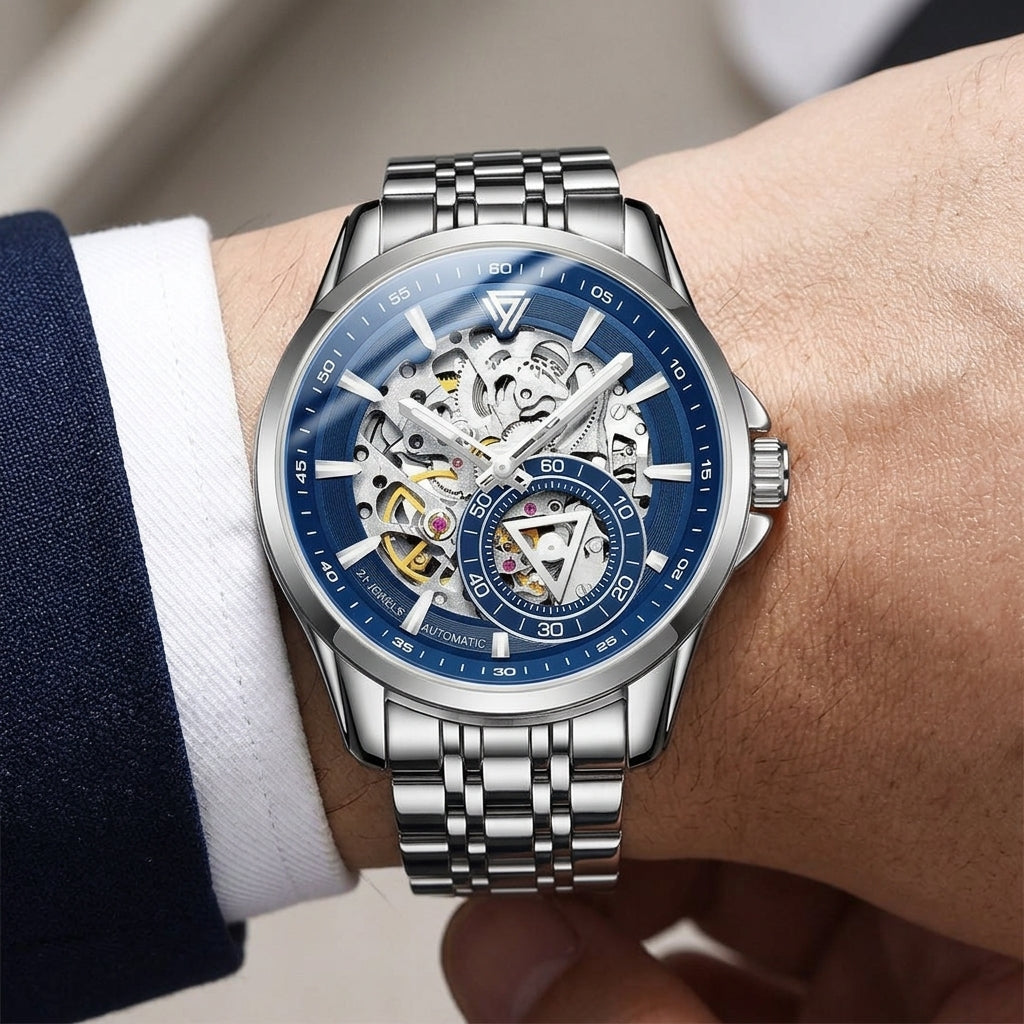 Silver wristwatch with blue face on a person&