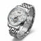 Silver wristwatch with detailed face on a white background