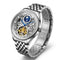 Silver wristwatch with intricate design on a white background
