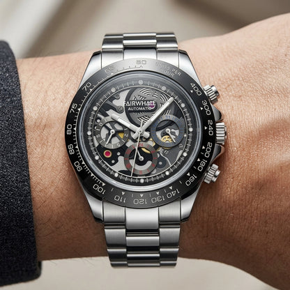 Silver wristwatch with visible brand name on a person&
