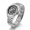 Silver wristwatch with visible brand name on a white background