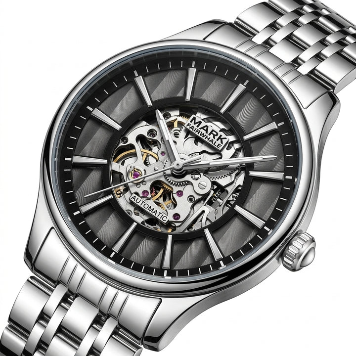 Silver wristwatch with visible mechanical components on a white background