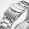 Stainless steel watch clasp macro close-up with brushed and polished metal bracelet links
