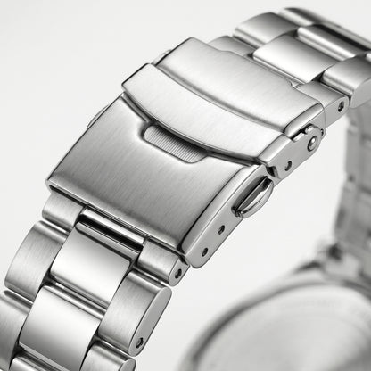 Stainless steel watch clasp macro close-up with brushed and polished metal bracelet links