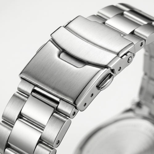 Stainless steel watch clasp macro close-up with brushed and polished metal bracelet links