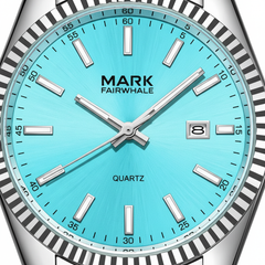 Watch with a turquoise dial and silver bezel on a white background