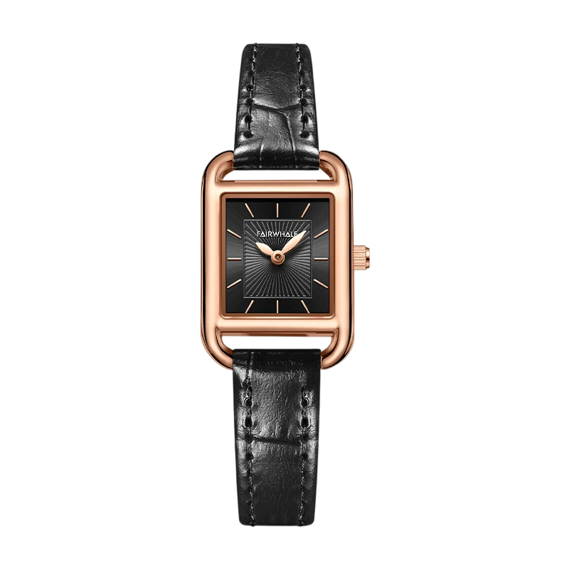 Watch with black leather strap and rose gold case on a white background