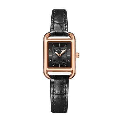 Watch with black leather strap and rose gold case on a white background