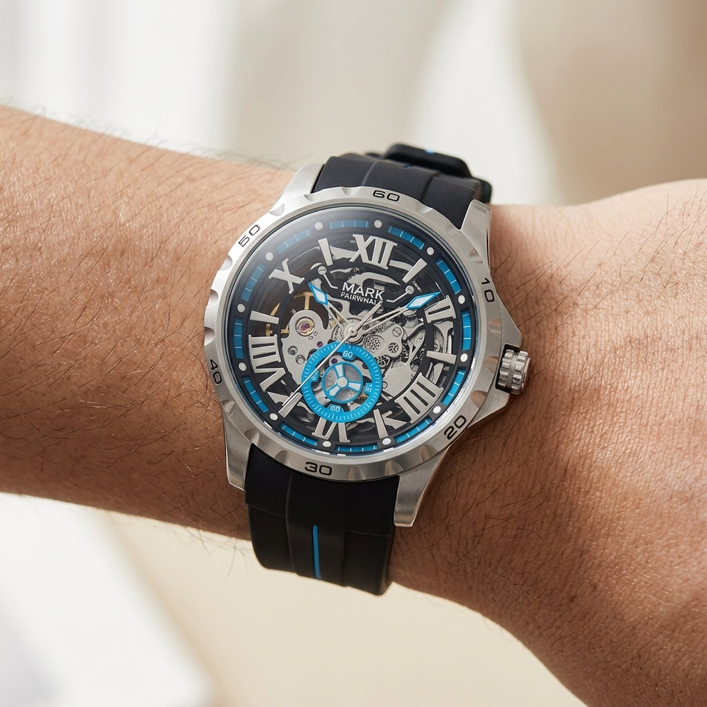 Watch with black strap and blue accents on a wrist against a blurred background